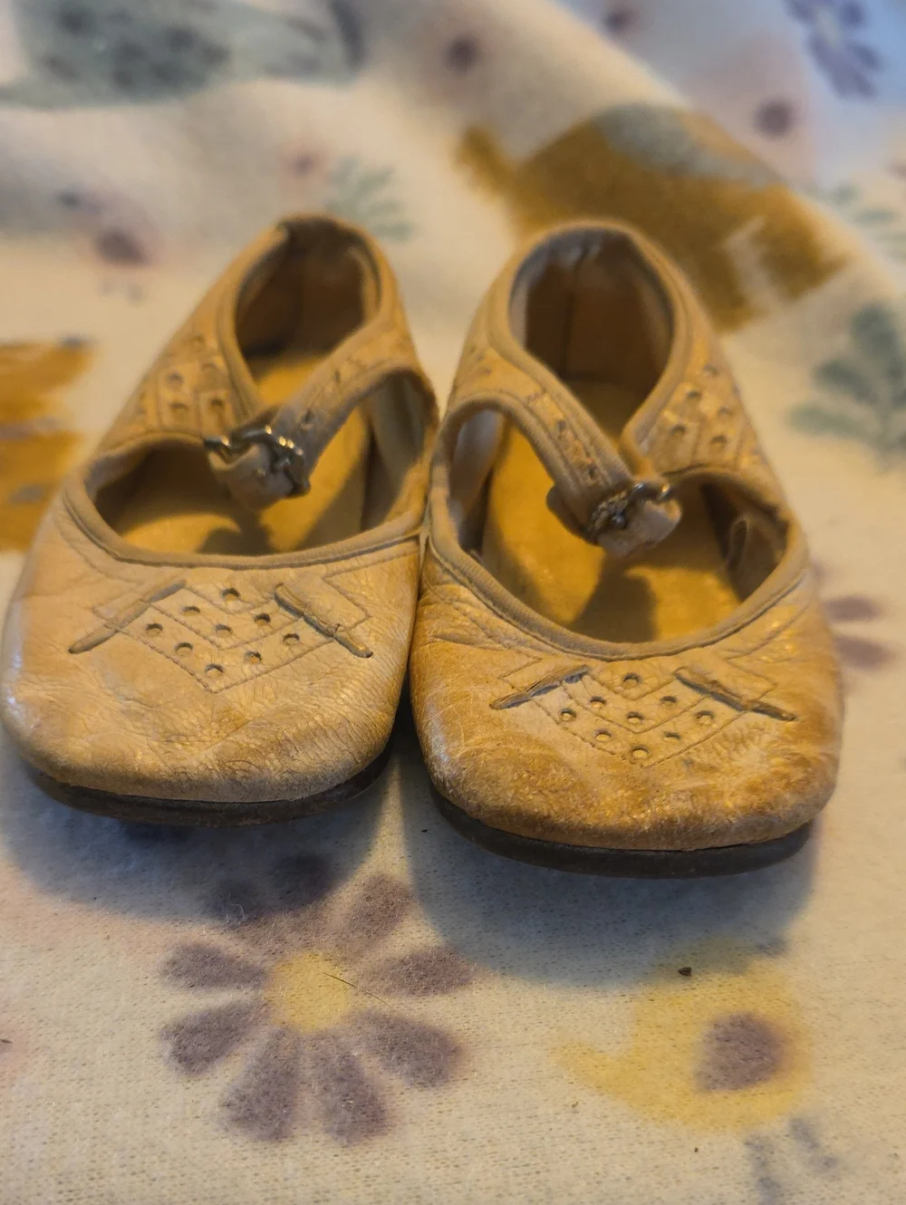 Vintage cream or tan leather Mary Jane-style infant or toddler shoes.
